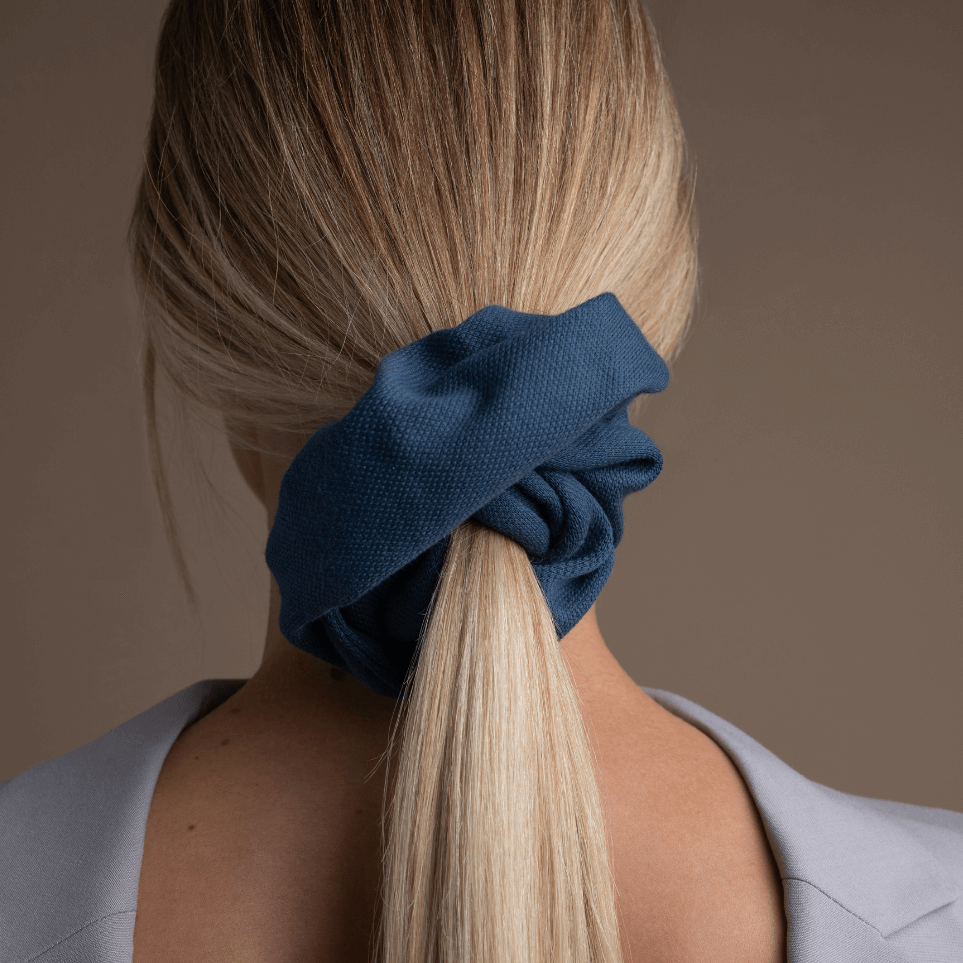 blonde woman wearing low ponytail with oversized statement scrunchie by sultany