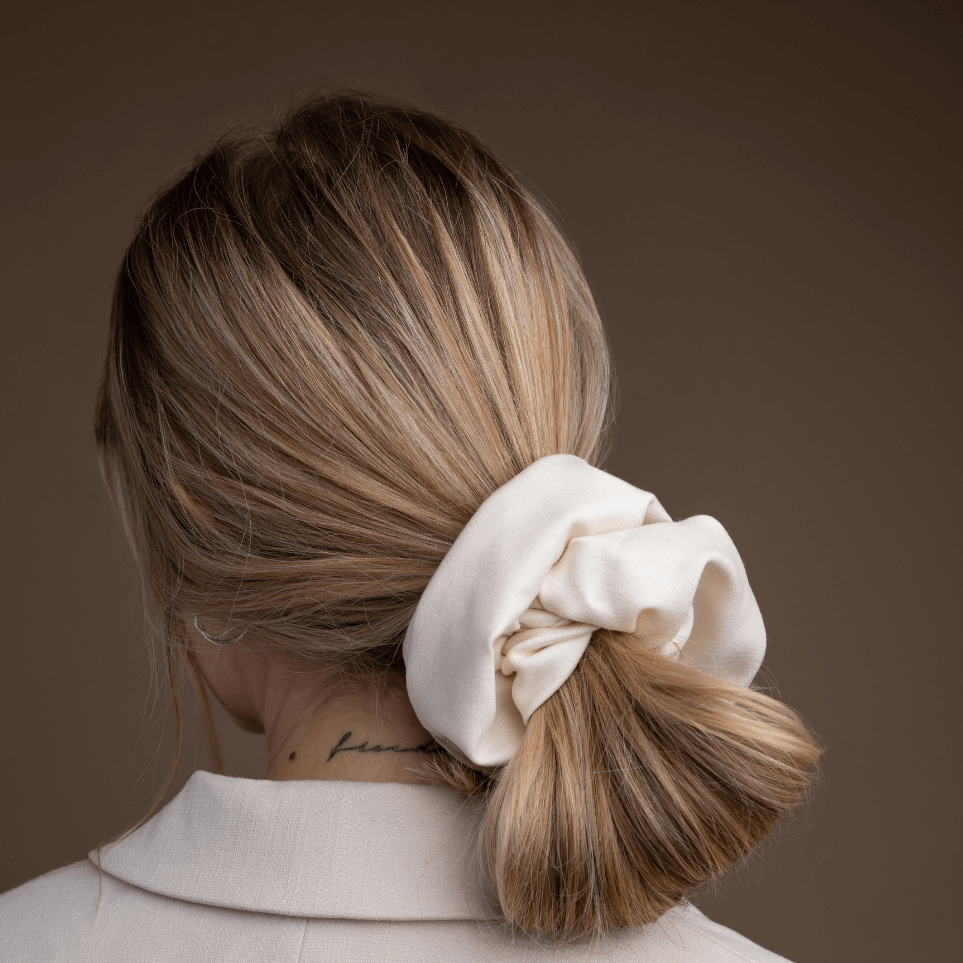 
                  
                    studio image of woman wearing beige jersey scrunchie by sultany
                  
                