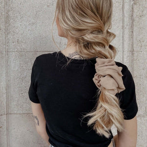 
                  
                    blonde girl wearing braid and beige jersey scrunchie
                  
                