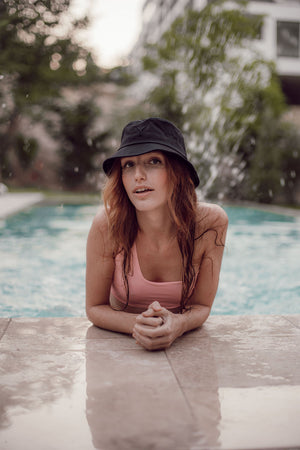 
                  
                    Black Bucket Hat on red haired girl in pool
                  
                