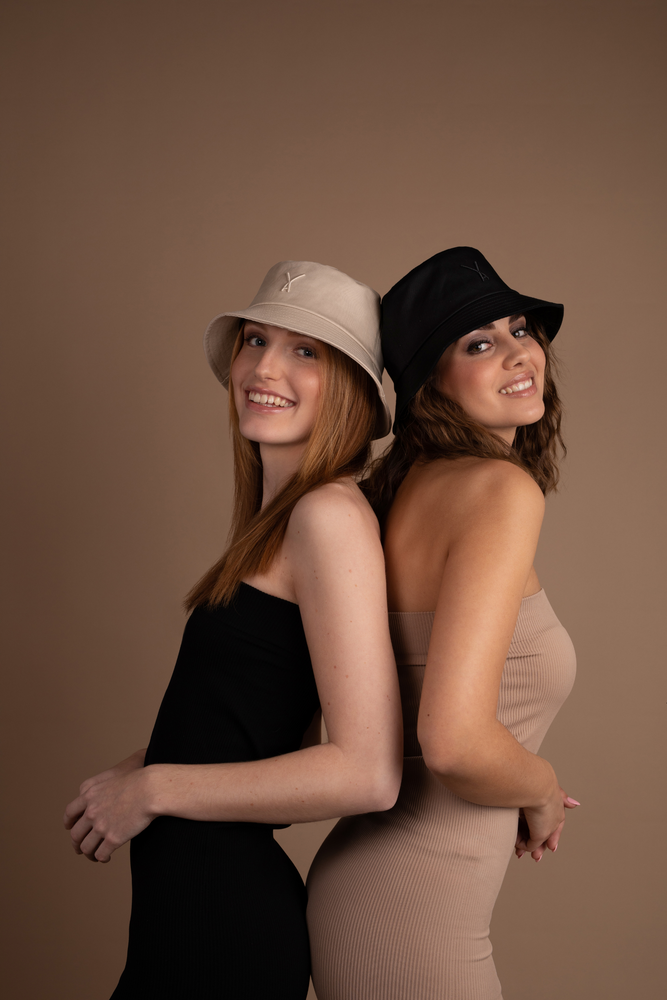
                  
                    Black Bucket Hat and Beige Bucket hat on two girls
                  
                