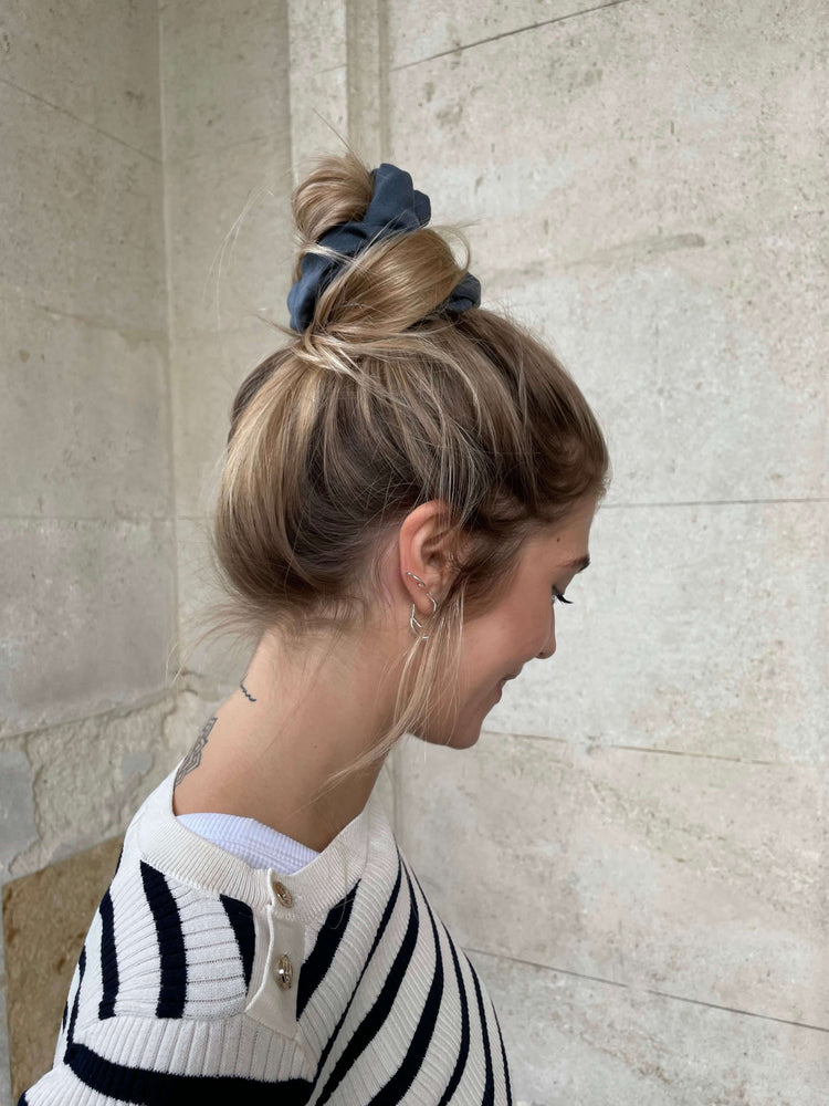 
                  
                    Blue Linen Scrunchie on blonde girl wearing messy bun
                  
                